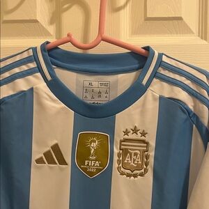 Argentina Blue and White Soccer Jersey with Gold Badge